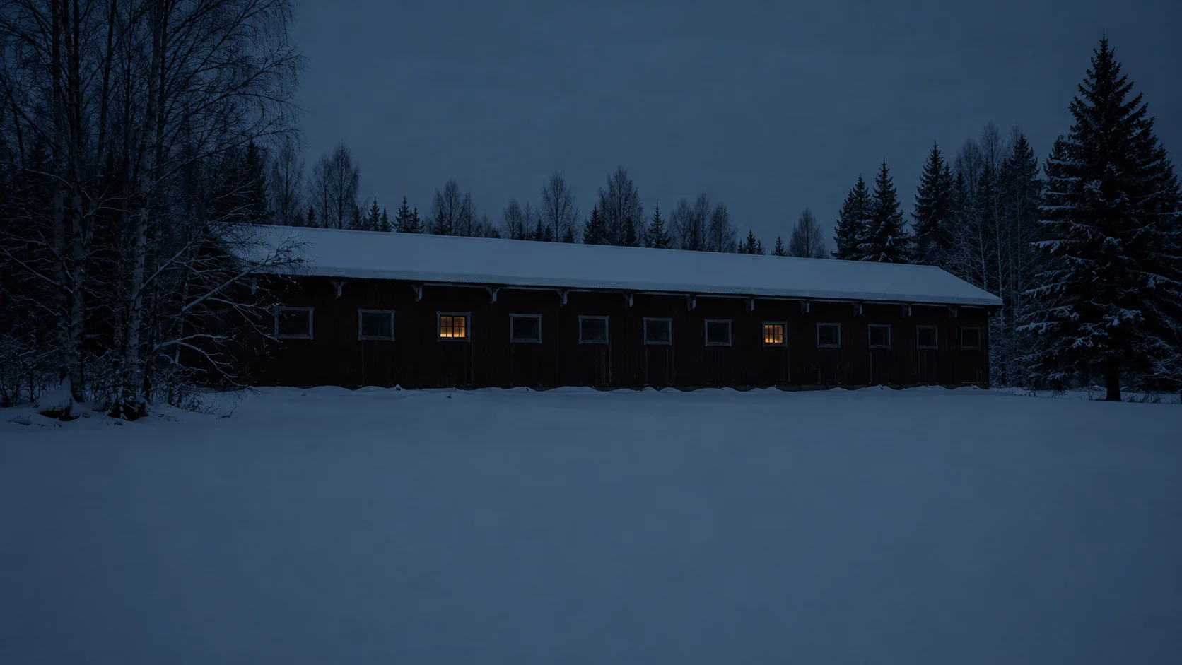 The Torkhuset from outside, in snow, at the blue hour